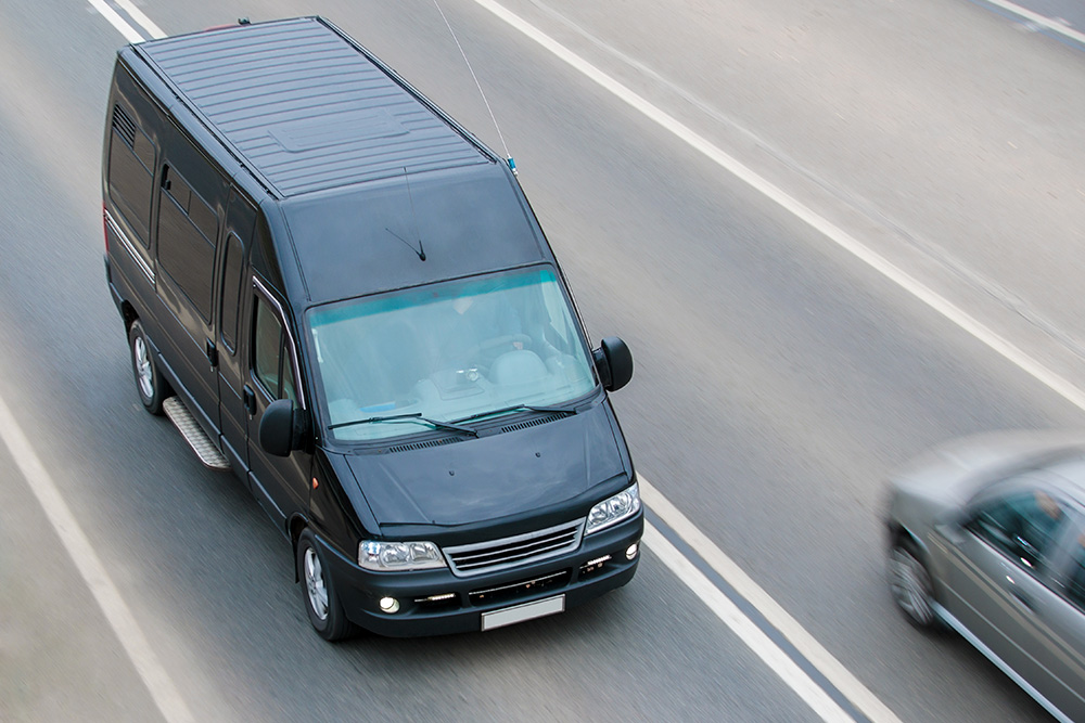 Commercial delivery van traveling on roadway – Traffic Court Buddy defense for defective equipment violations